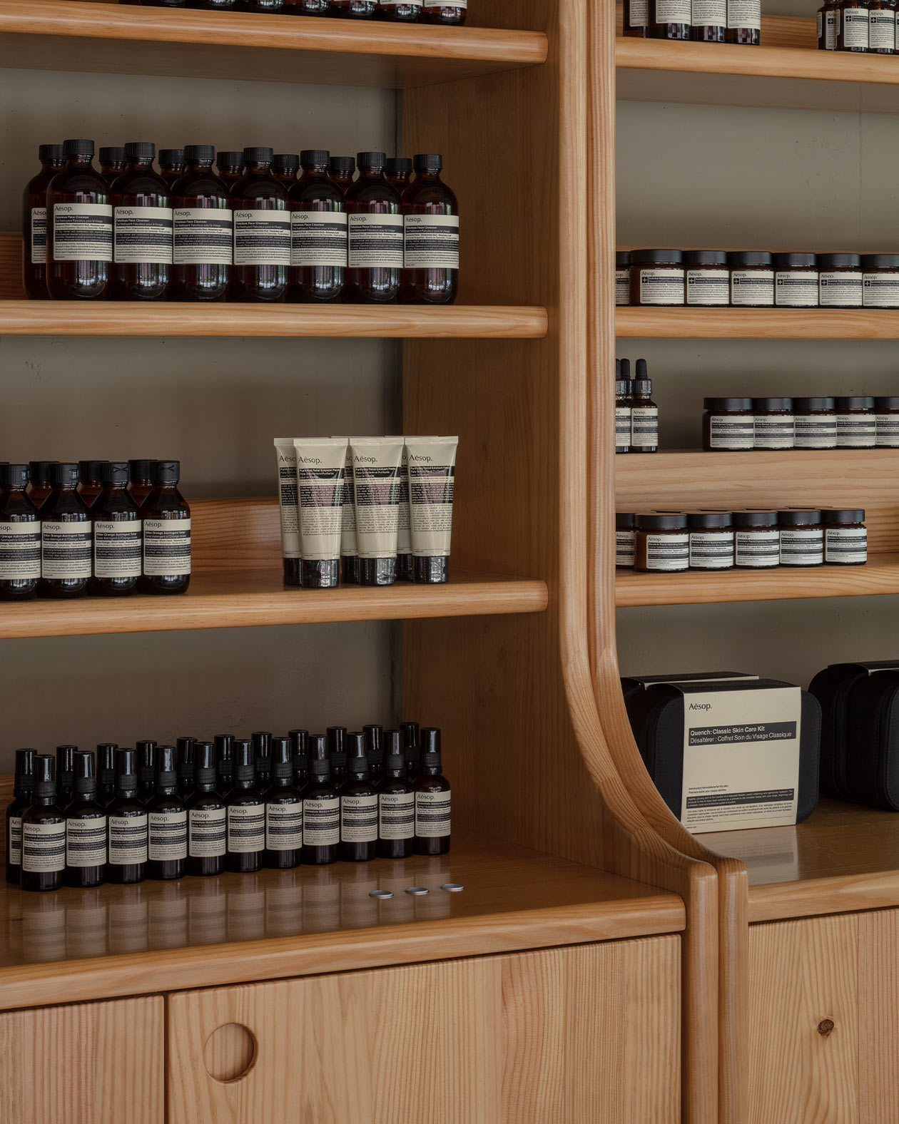 Aesop products on the pine wood shelves