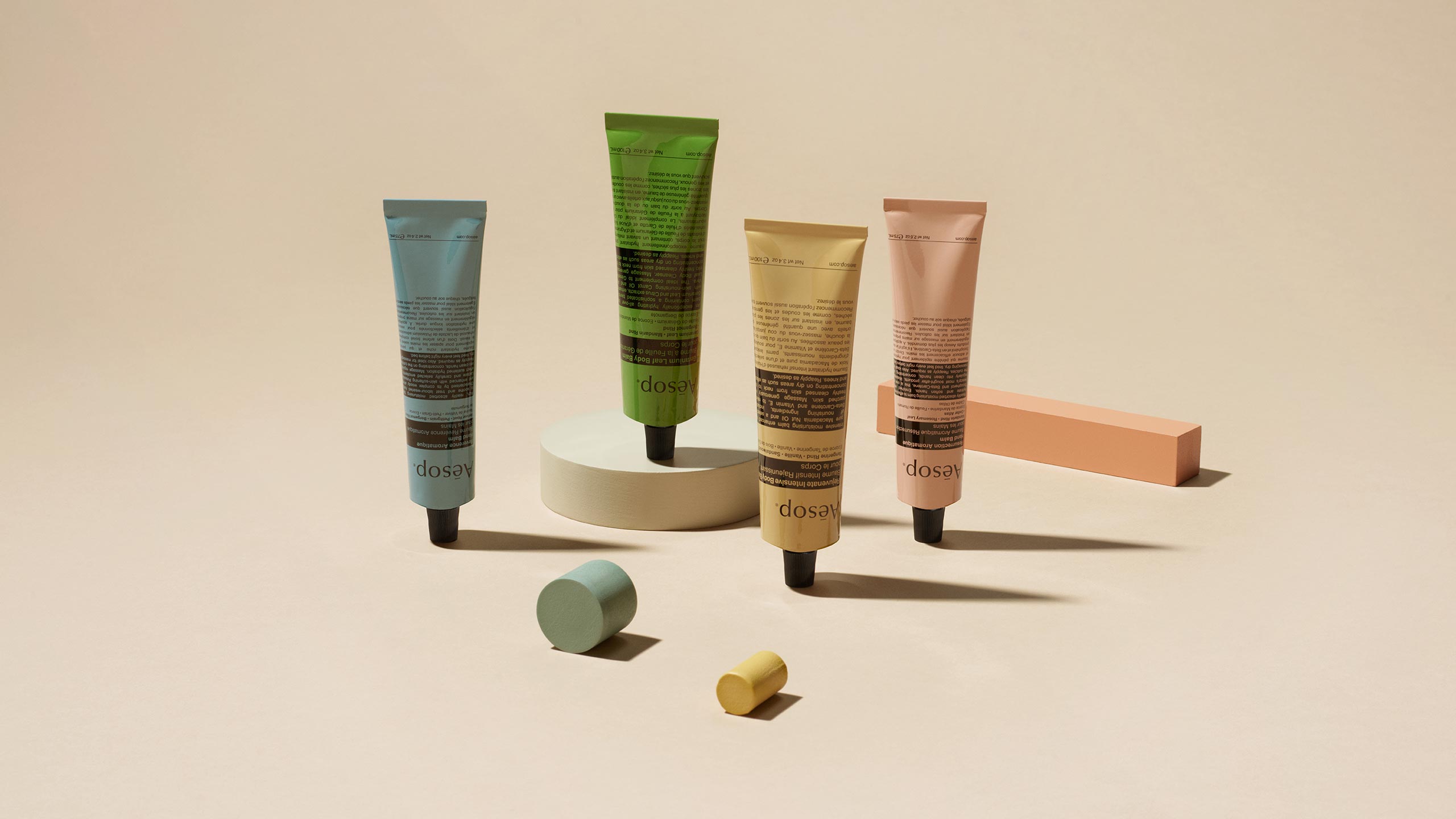 Aesop's body balms, in tubes of different colours