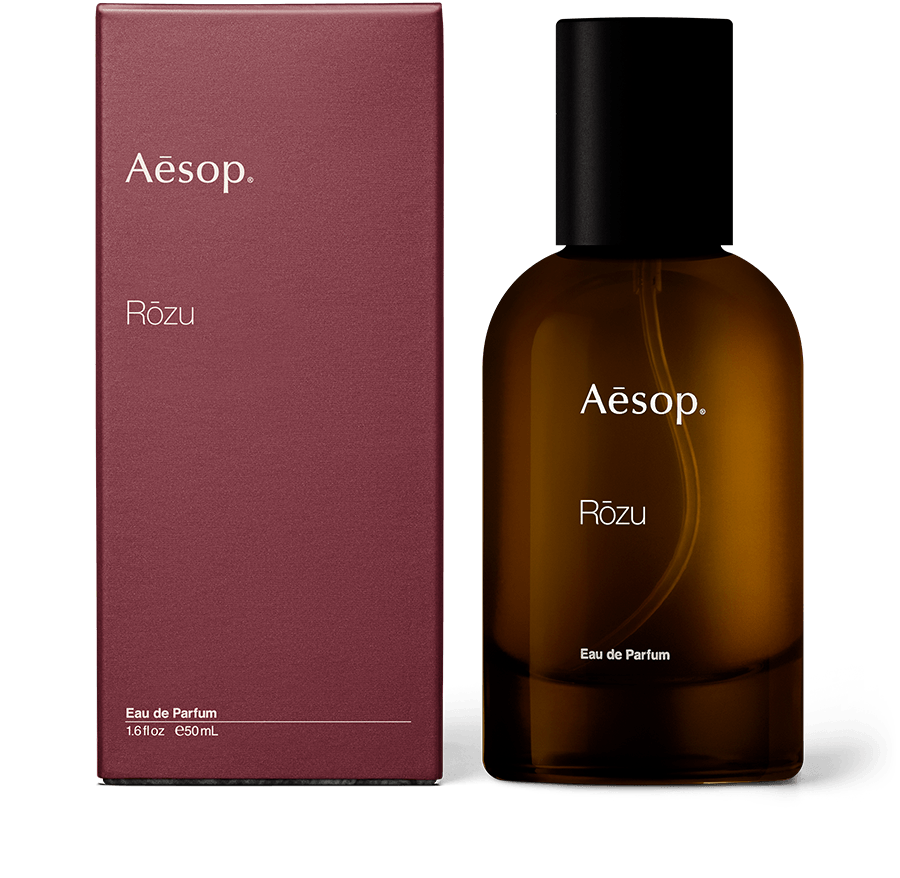 Rōzu Eau de Parfum In Amber Bottle next to Carton