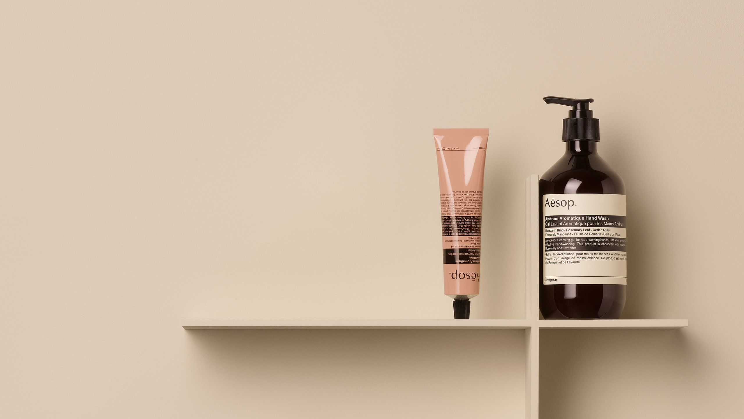 Andrum Aromatique Hand Wash alongside Andrum Aromatique Hand Balm with a beige background
