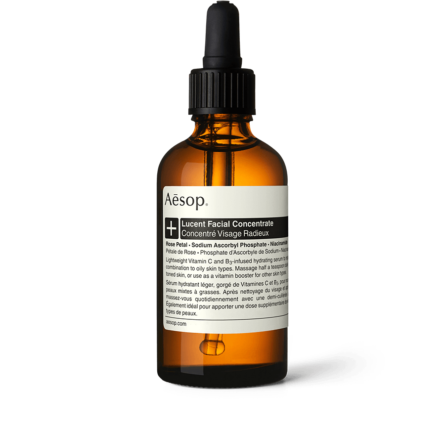 Lucent Facial Concentrate in an amber glass bottle with a pipette.