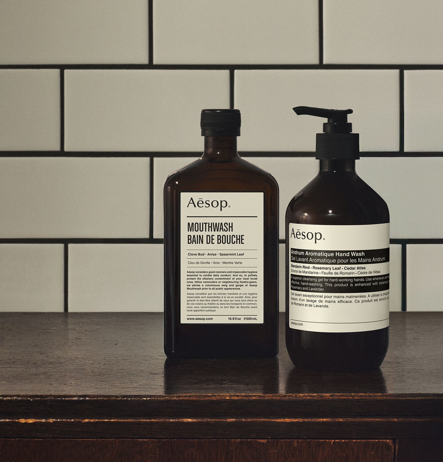 Mouthwash and Andrum Aromatique Hand Wash on a wooden surface, in a white tiles background