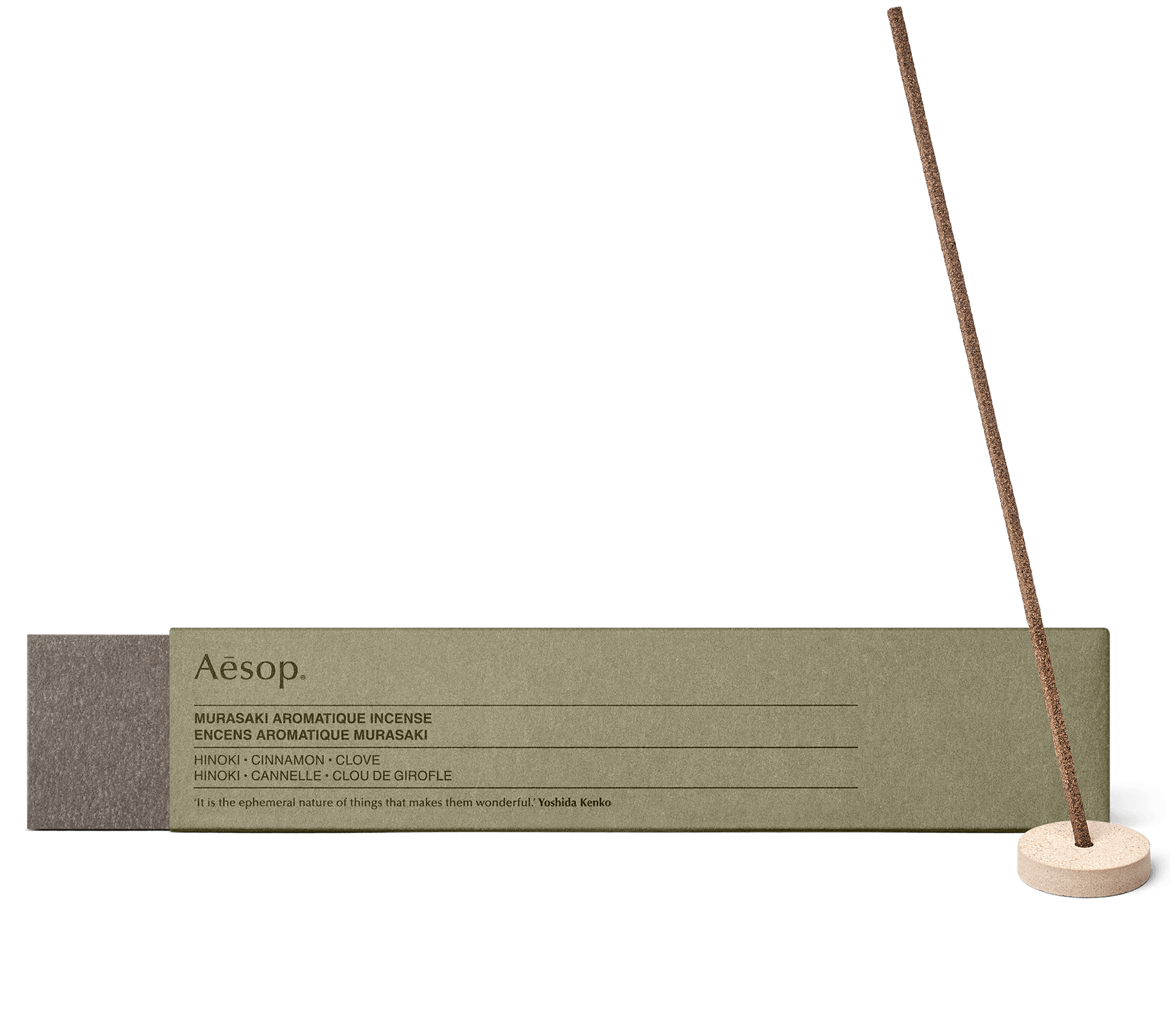 A stick of Murasaki Aromatique Incense in the Kanuma pumice holder, alongside carton packaging. 