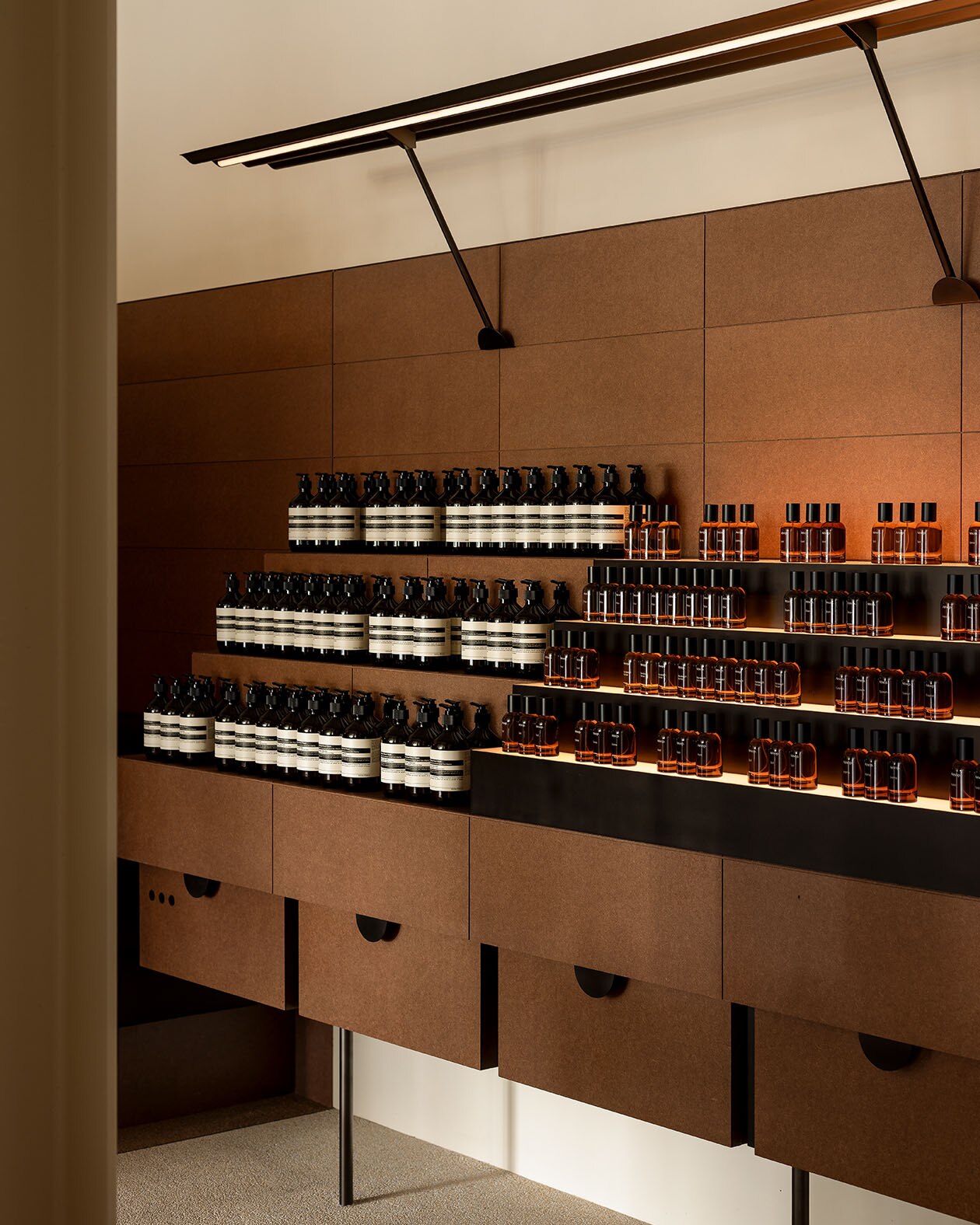 Aesop products placed on the tiered shelves.