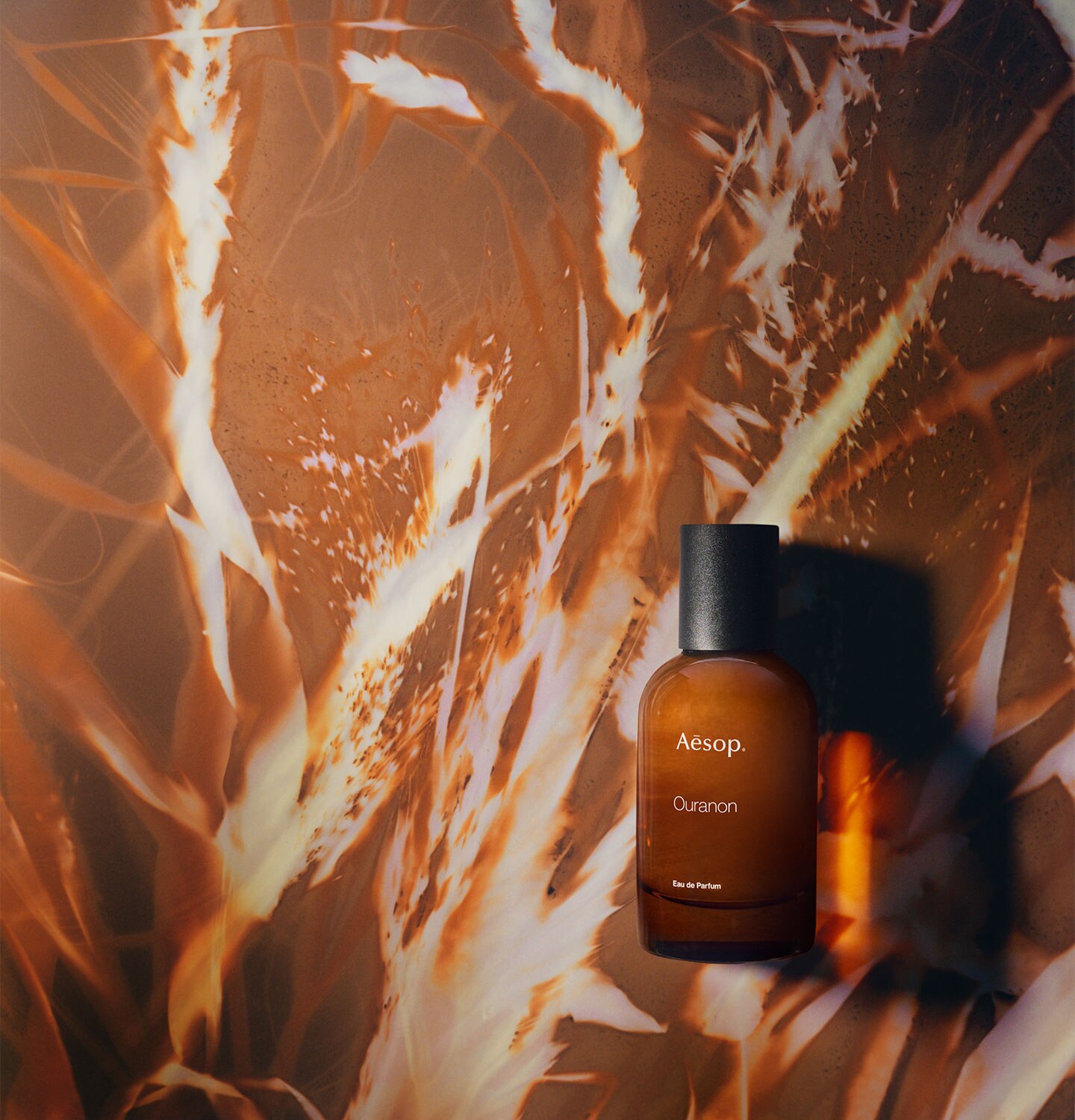 An amber bottle of Ouranon Eau de Parfum