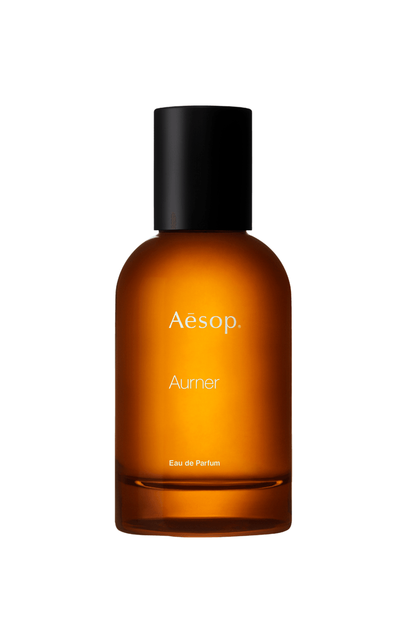 Aurner Eau de Parfum in amber bottle.