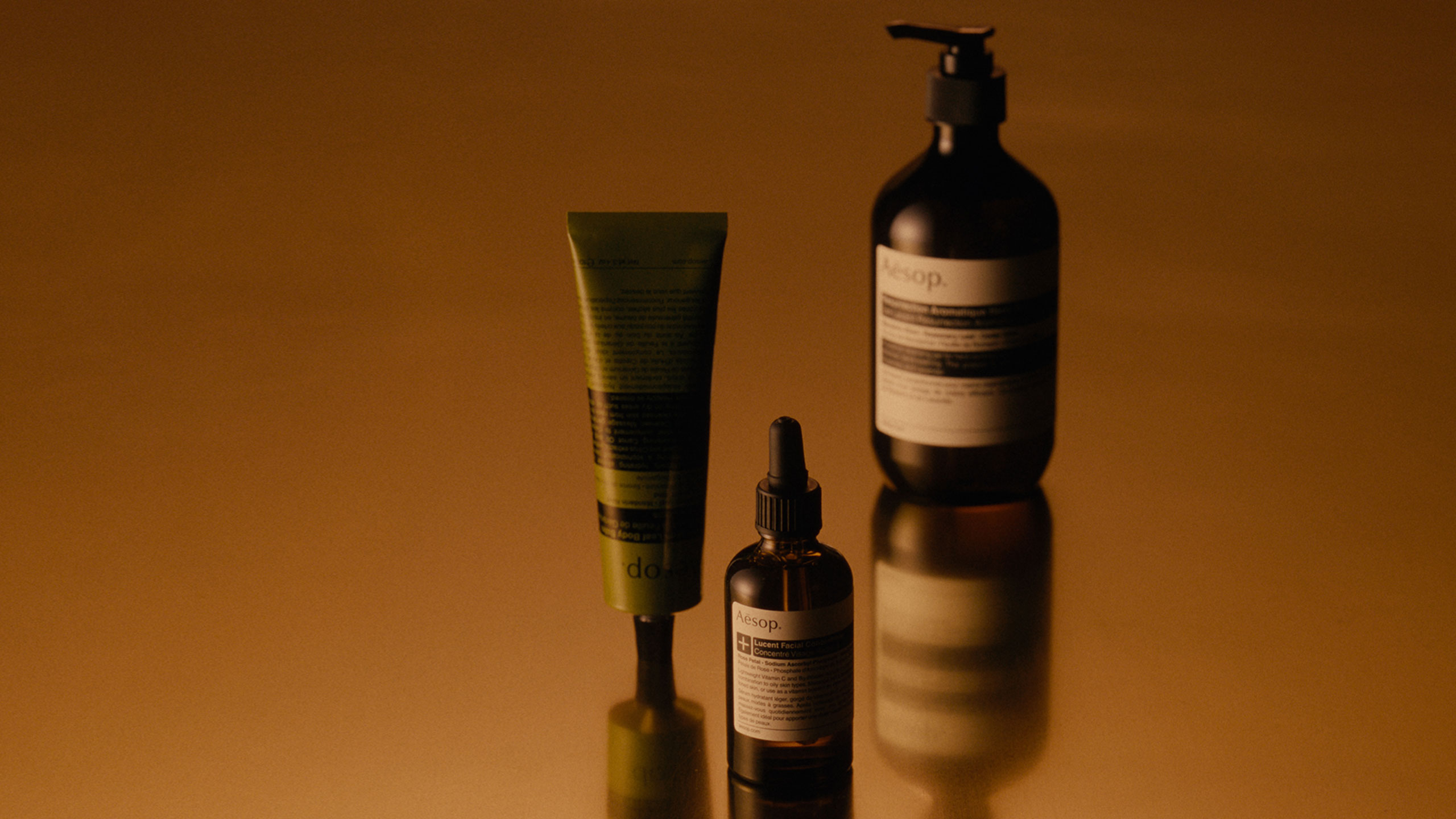 Aesop products placed in amber background