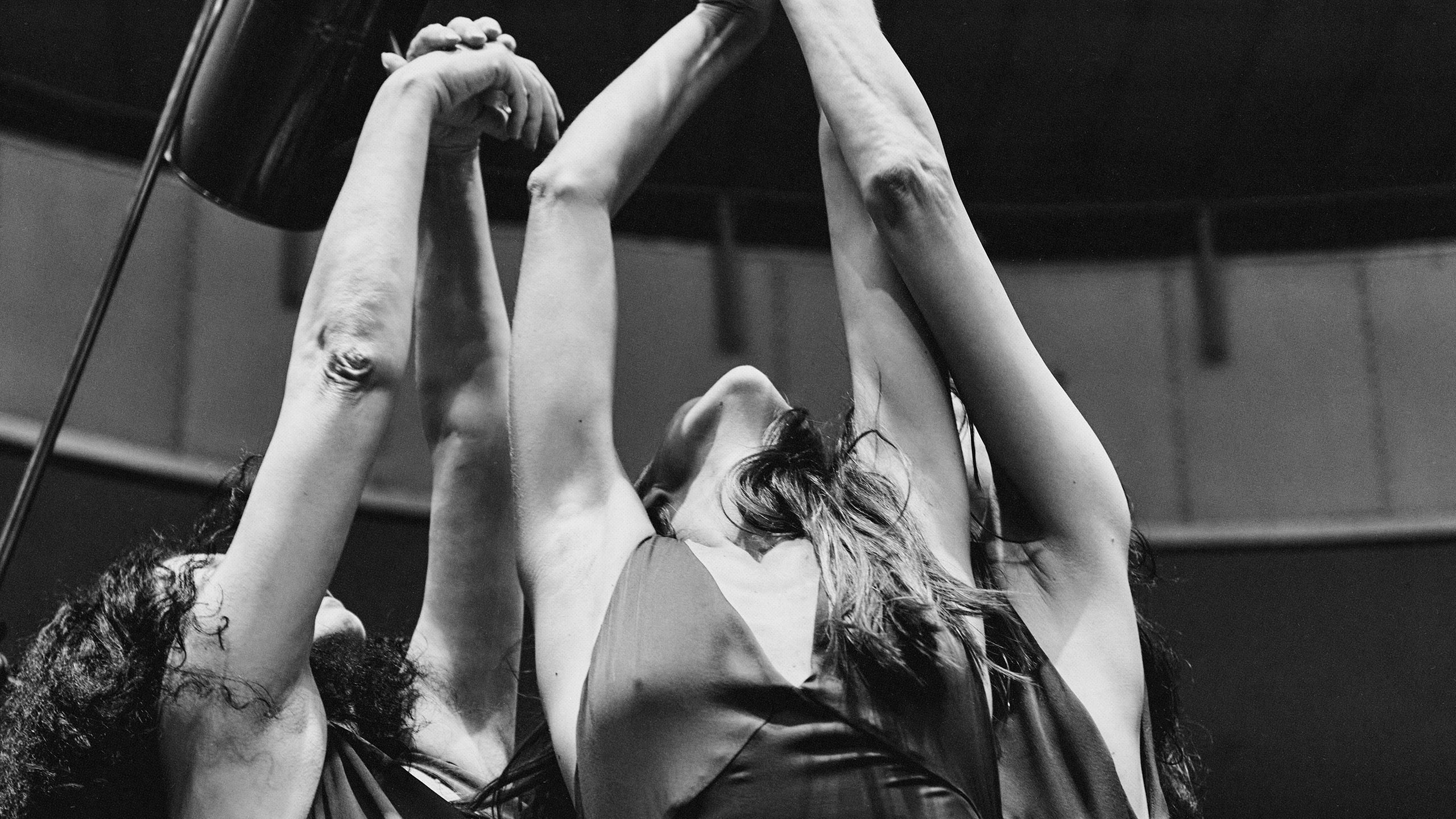 Individuals raising hands